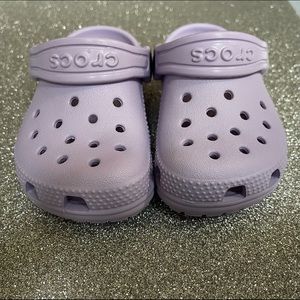 Purple Crocs is almost perfect condition.